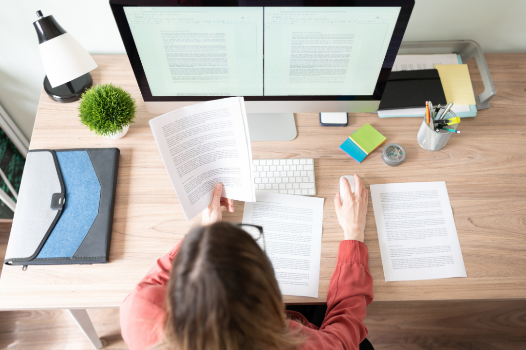 international student holding visa paperwork