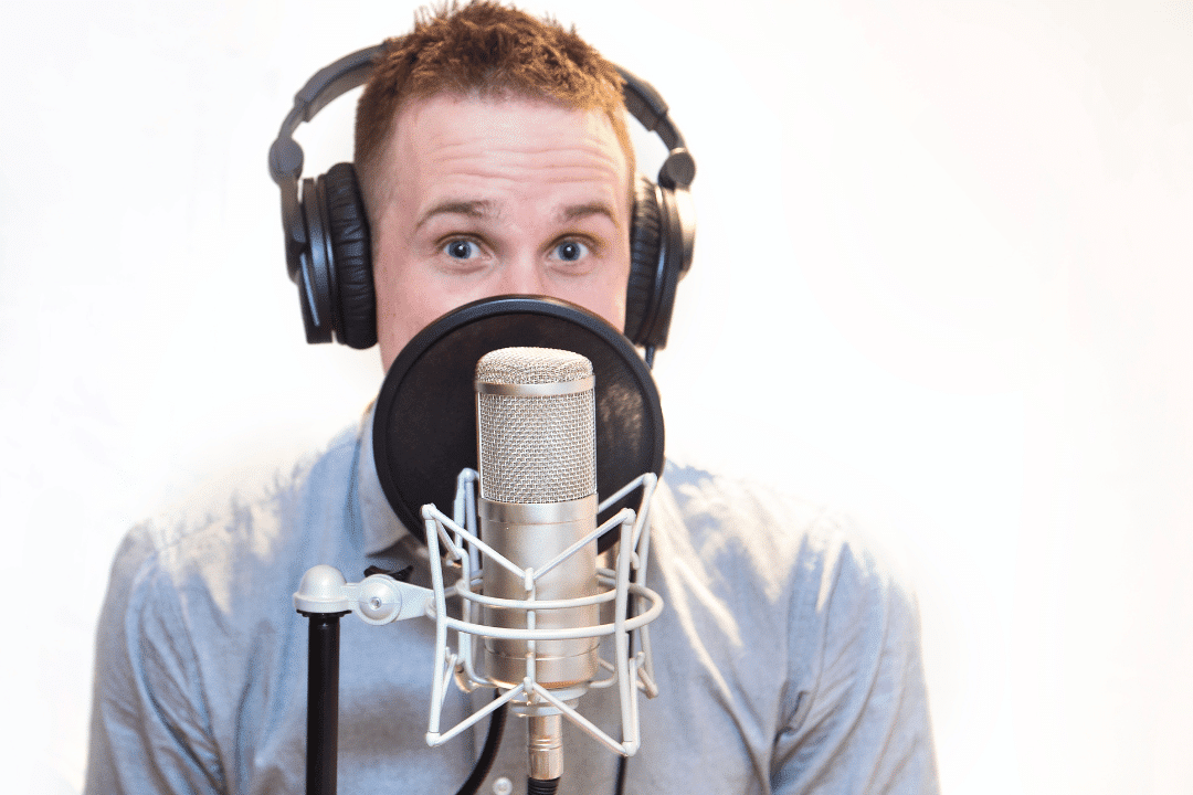 a voice actor recording audio in a studio at Translingua